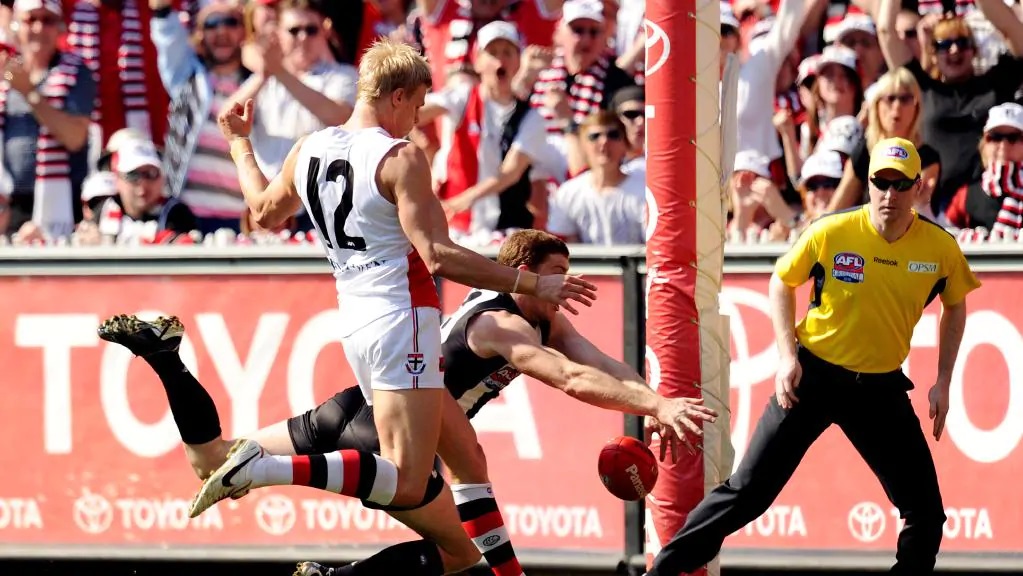 Heath Shaw sneaks up on Nick Riewoldt like a librarian one of the Pinch Hitters Top Six Magpies Moments of the 2010's.